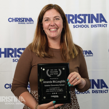 Photo of Amanda McLaughlin 2025-2026 Teacher of the Year Gallaher ES with award